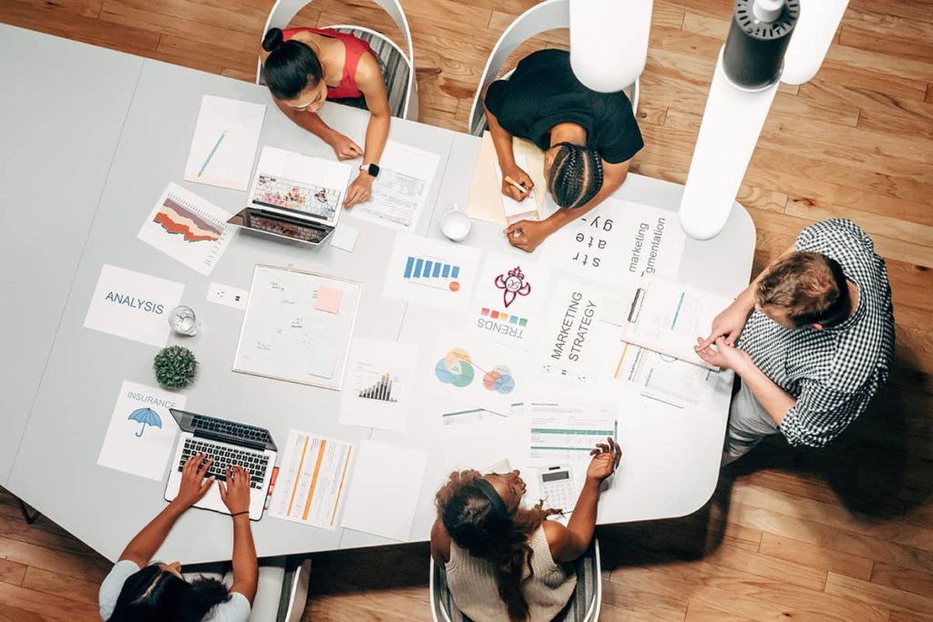 Marketing team around a conference table as seen from above