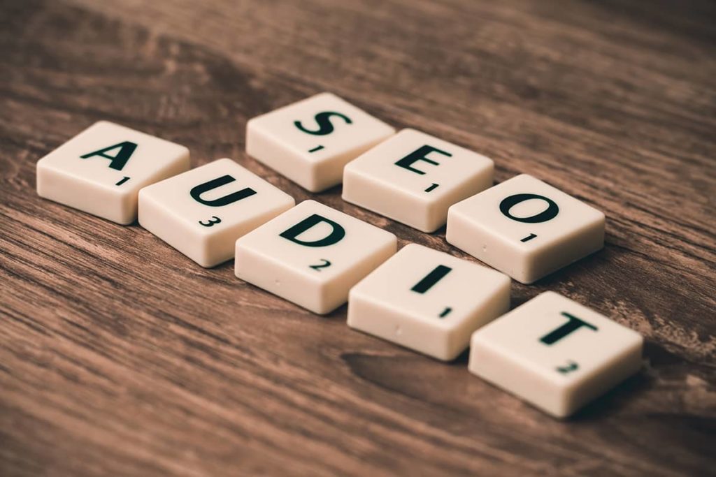 Scabble tiles spelling out SEO Audit on a table